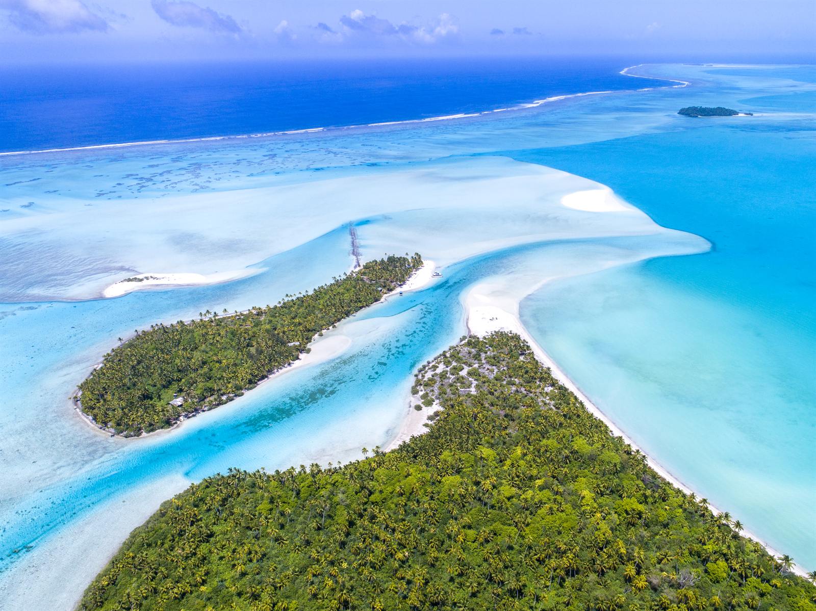 Aitutaki lagoon from the air, turquoise water and white sand