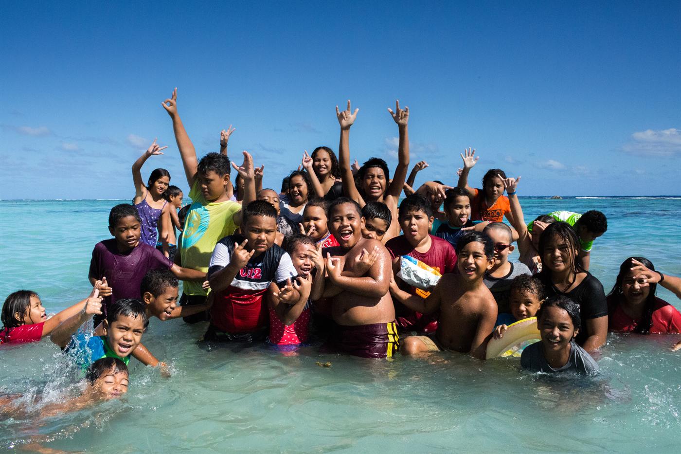 Children laughing together in the lagoon